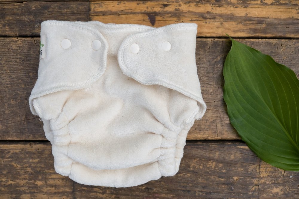 Closeup shot of organic white baby diapers on a wooden surface